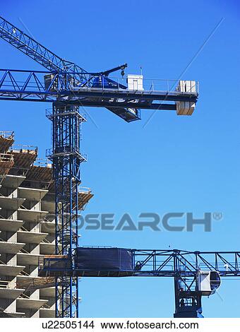 Building under construction and crane View Large Photo Image Picture - Building under construction and crane. Fotosearch