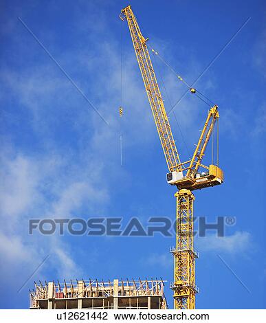 Building under construction and crane View Large Photo Image Stock Image - Building under construction and crane. Fotosearch