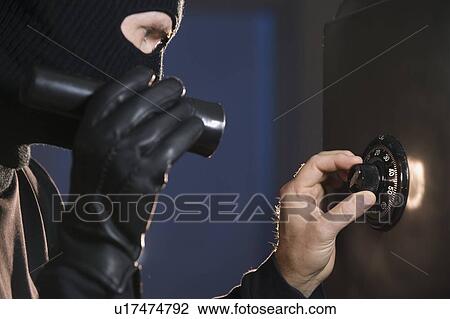 Burglar cracking safe View Large Photo Image Stock Image - Burglar cracking safe. Fotosearch