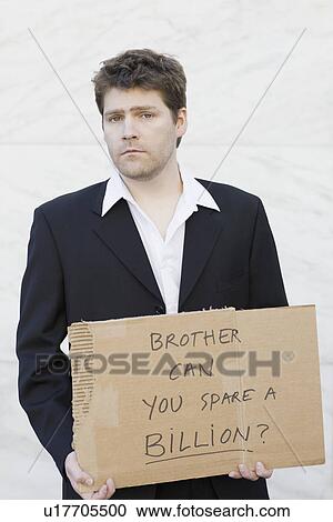 Stock Image - Businessman begging for money. Fotosearch