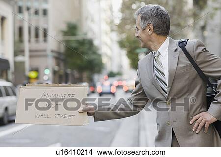 Picture - Businessman hitchhiking. Fotosearch