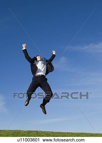 Businessman jumping air View Large Photo Image Stock Image - Businessman jumping air. Fotosearch