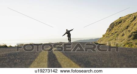 Businessman running on remote road View Large Photo Image Stock Image - Businessman running on remote road. Fotosearch