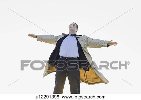 Businessman standing in wind View Large Photo Image Stock Photography - Businessman standing in wind. Fotosearch