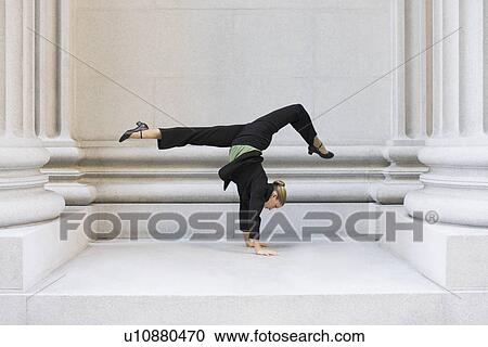 Businesswoman dancing in urban setting View Large Photo Image Stock Image - Businesswoman dancing in urban setting. Fotosearch