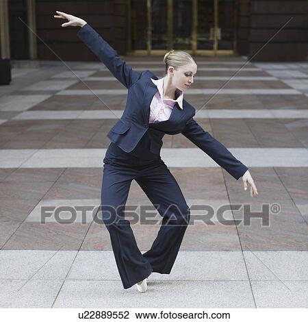 Businesswoman dancing in urban setting View Large Photo Image Stock Image - Businesswoman dancing in urban setting. Fotosearch