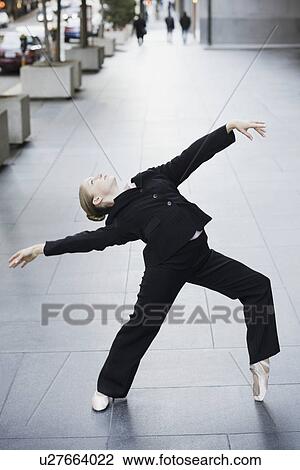 Businesswoman dancing in urban setting View Large Photo Image Stock Image - Businesswoman dancing in urban setting. Fotosearch