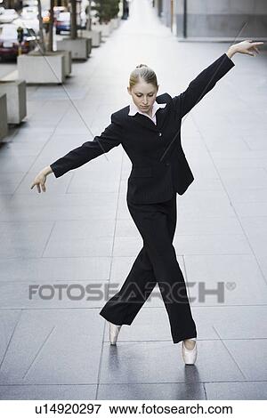Businesswoman dancing in urban setting View Large Photo Image Stock Photo - Businesswoman dancing in urban setting. Fotosearch