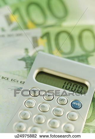 Calculator and 100 euro notes View Large Photo Image Stock Image - Calculator and 100 euro notes. Fotosearch