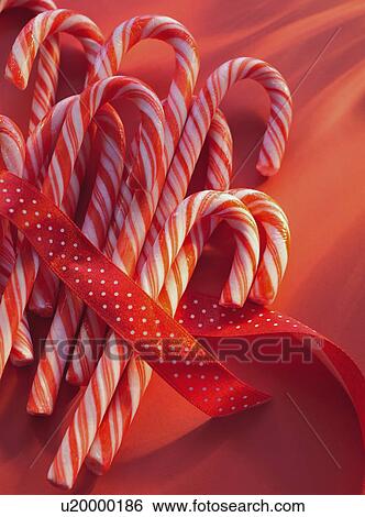 Candy canes and ribbon View Large Photo Image Stock Photograph - Candy canes and ribbon. Fotosearch