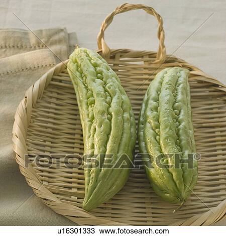 Chinese bitter melon in basket View Large Photo Image Stock Image - Chinese bitter melon in basket. Fotosearch