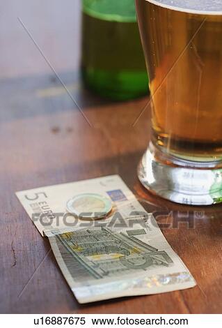 Close up of beer and money View Large Photo Image Stock Photography - Close up of beer and money. Fotosearch