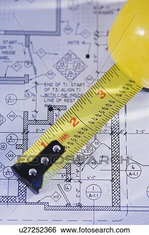 Close up of blueprint and tape measure View Large Photo Image Stock Photograph - Close up of blueprint and tape measure. Fotosearch