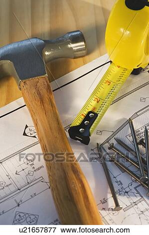 Stock Photo - Close up of blueprint and tools. Fotosearch