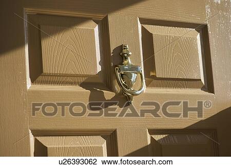 Stock Image - Close up of door knocker. Fotosearch