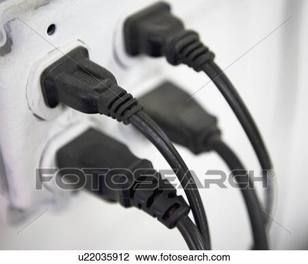 Stock Image - Close up of electric plugs. Fotosearch