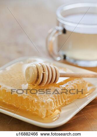 Stock Photograph - Close up of fresh honeycomb. Fotosearch