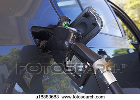 Close up of gas pump in car View Large Photo Image Stock Image - Close up of gas pump in car. Fotosearch