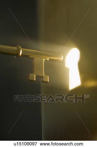 Stock Photo - Close up of keyhole and key. Fotosearch