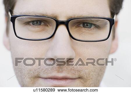 Close up of man wearing eyeglasses View Large Photo Image Stock Photo - Close up of man wearing eyeglasses. Fotosearch
