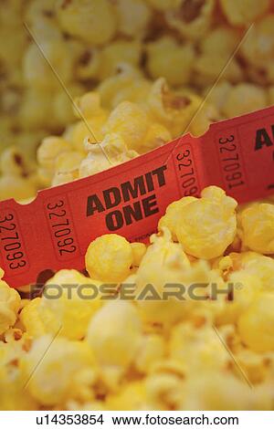 Picture - Close up of movie tickets and popcorn. Fotosearch