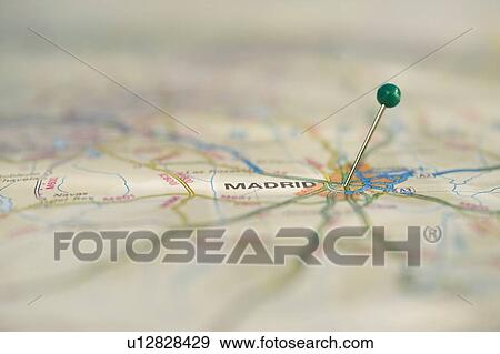Stock Photo - Close up of pin on map location. Fotosearch