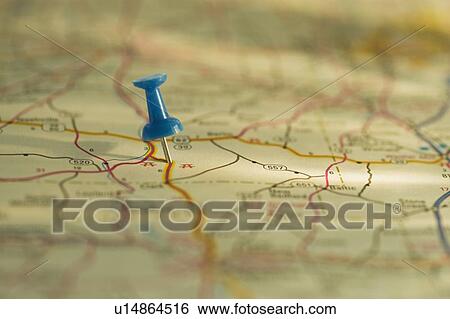Stock Photograph - Close up of pin on map location. Fotosearch
