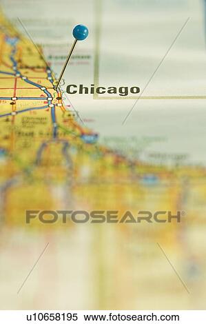 Stock Photography - Close up of pin on map location. Fotosearch