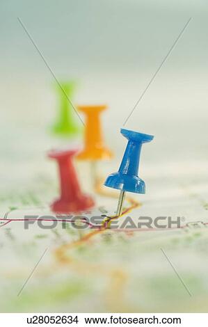 Picture - Close up of pins on map locations. Fotosearch
