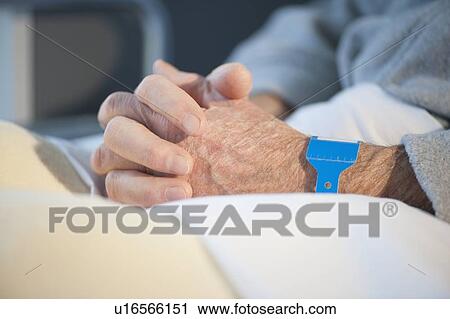 Close up of senior man in hospital View Large Photo Image Stock Image - Close up of senior man in hospital. Fotosearch