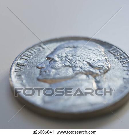 Stock Image - Close up of silver coin. Fotosearch