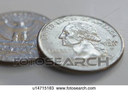 Stock Image - Close up of silver coins. Fotosearch