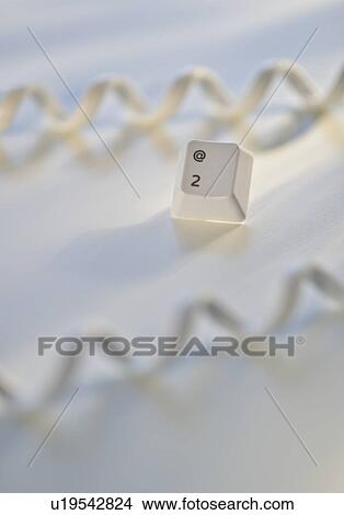 Close up of telephone cord and computer key View Large Photo Image Picture - Close up of telephone cord and computer key. Fotosearch