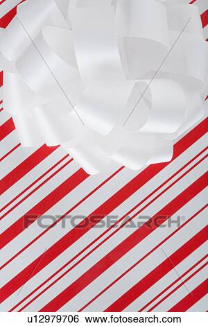 Close up of wrapped Christmas gift View Large Photo Image Stock Photograph - Close up of wrapped Christmas gift. Fotosearch