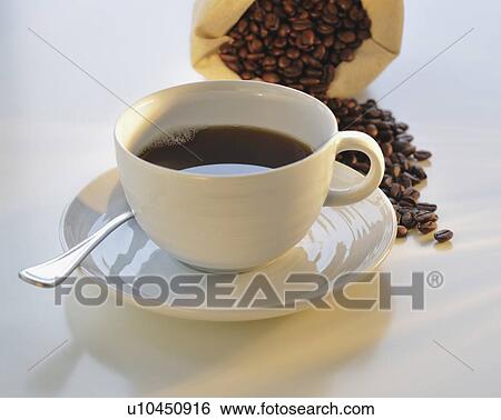 Coffee cup and coffee beans View Large Photo Image Stock Photograph - Coffee cup and coffee beans. Fotosearch