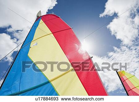 Stock Image - Colorful boat sails. Fotosearch