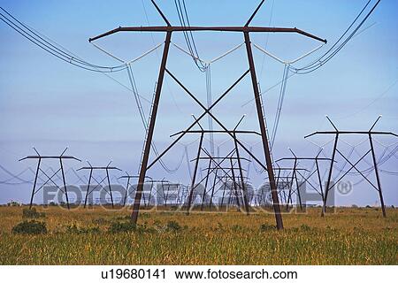 Stock Image - Communication towers and power lines. Fotosearch