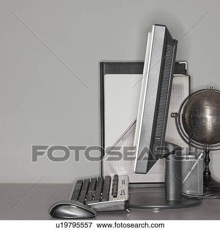Computer and globe on office desk View Large Photo Image Stock Photo - Computer and globe on office desk. Fotosearch