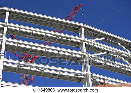 Stock Photograph - Construction beams and crane. Fotosearch