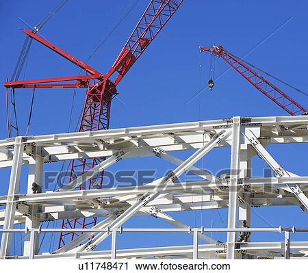 Construction beams and cranes View Large Photo Image Stock Image - Construction beams and cranes. Fotosearch