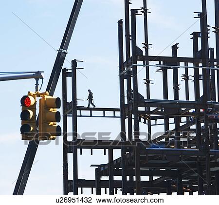 Construction worker walking on beams View Large Photo Image Stock Image - Construction worker walking on beams. Fotosearch