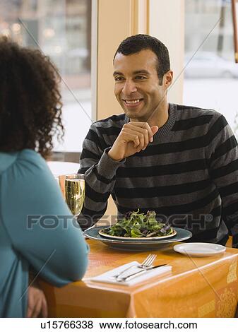 Stock Photo - Couple eating in restaurant. Fotosearch
