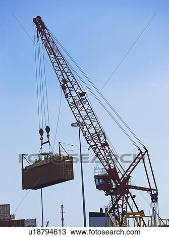 Cranes moving shipping containers View Large Photo Image Stock Image - Cranes moving shipping containers. Fotosearch