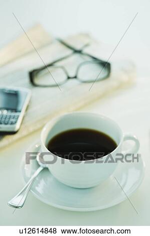 Cup of coffee and business tools View Large Photo Image Stock Photo - Cup of coffee and business tools. Fotosearch