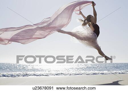Dancer leaping on beach View Large Photo Image Stock Image - Dancer leaping on beach. Fotosearch