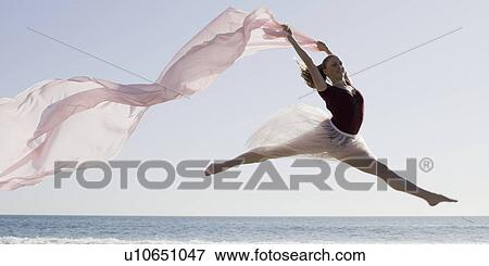 Dancer leaping on beach View Large Photo Image Stock Photo - Dancer leaping on beach. Fotosearch