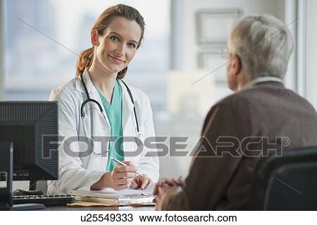 Doctor consulting with senior man View Large Photo Image Stock Image - Doctor consulting with senior man. Fotosearch