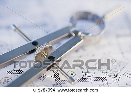 Drawing compass and blueprints View Large Photo Image Picture - Drawing compass and blueprints. Fotosearch
