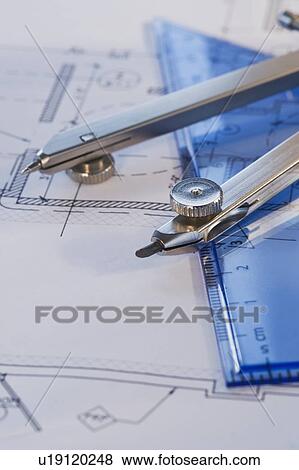 Stock Photo - Drawing compass and blueprints. Fotosearch