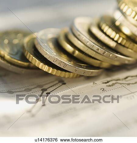 Stock Photograph - Euro coins on financial graph. Fotosearch